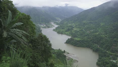 river is flowing between two mountain