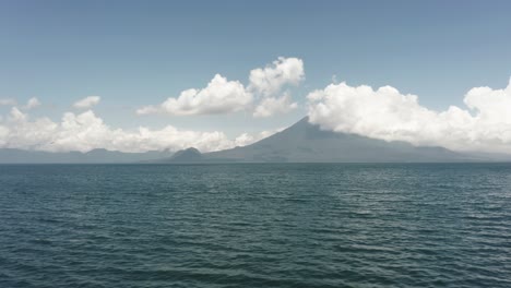 drone flying over waters of atitlan lake in guatemala