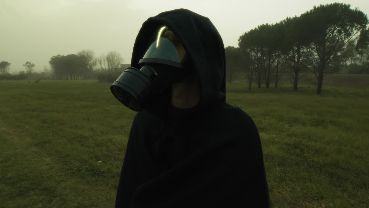 Man In Radiation Mask Observes Post Apocalyptic Environment
