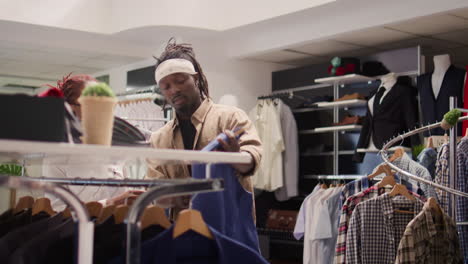 specialist advises man in thrift shop
