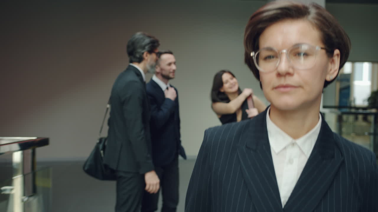 Business People Interacting in Office Corridor