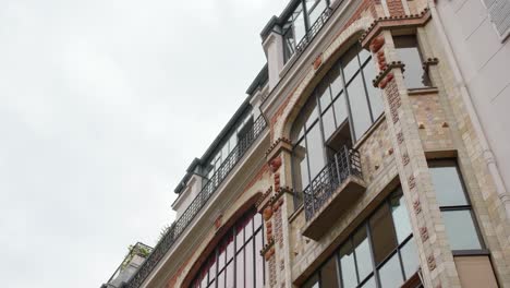 exterior detail of art deco building in rue campagne premiere, 14th arrondissement of paris, france