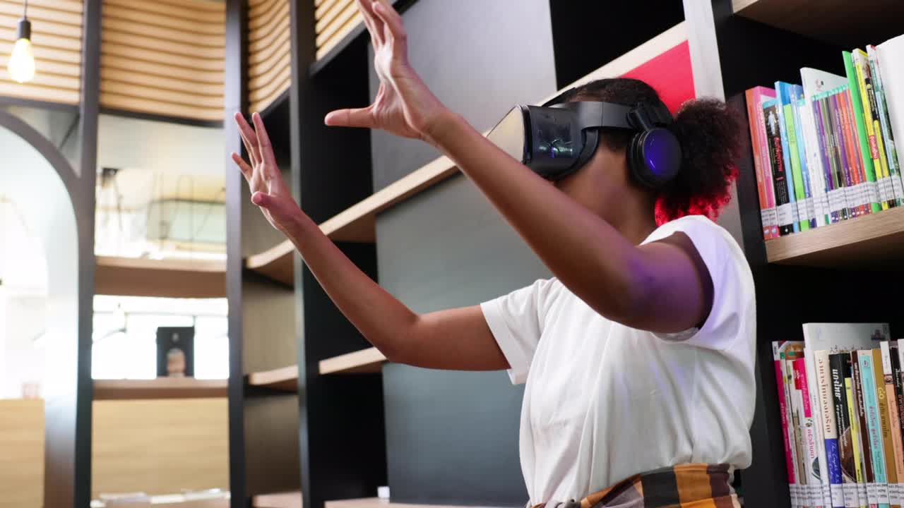 VR headset library. Young teen girl student training and learning with VR virtual teality headset in school library.