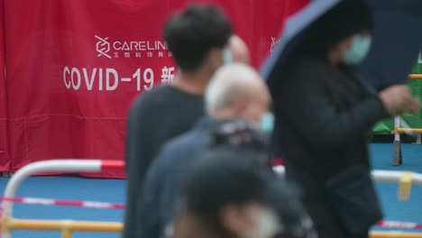 a tent displayed covid-19 name, also commonly known as coronavirus, during a mass screening testing outside after a large number of residents tested positive