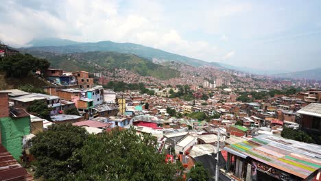 fixed establishing shot of comuna 13 on cloudy day