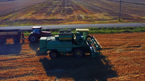 Combine-Harvester-At-Work-On-Golden-Wheat-Field-During-Harvest-Season-In-Lithuania