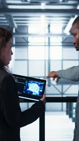 vertical video data center technicians deploying ai driven management tools using tablet