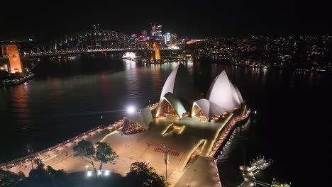 opera house in sydney aerial night. famous landmarks of australian metropolitan city.