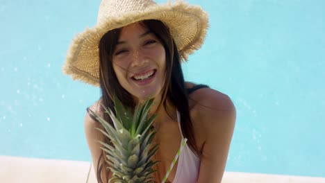 Young-woman-sipping-a-pineapple-cocktail