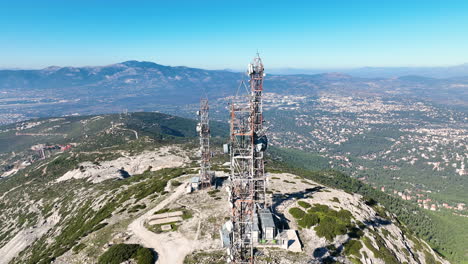 drone footage of telecommunication towers on a mountain