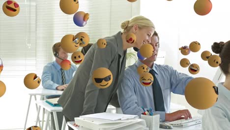 Animation-of-emoji-falling-over-business-people-wearing-phone-headsets