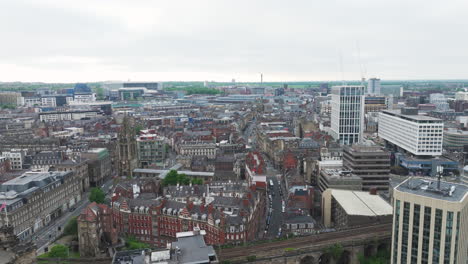 Newcastle-cityscape-with-historic-and-modern-buildings,-cloudy-day,-aerial-view