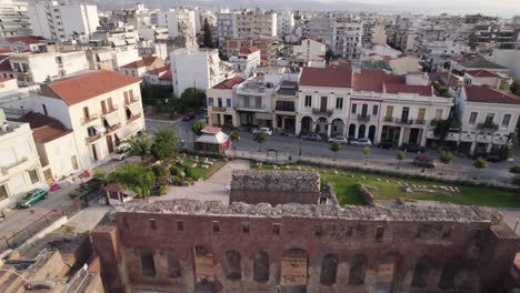 Aerial-pullback-shot-of-Roman-Odeon-of-Patras,-Antique-Amphitheatre,-Greece