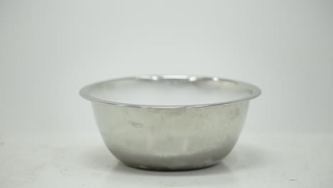 water poured over dry ice in a bowl