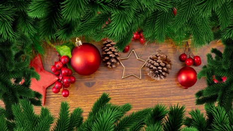 Animation-of-christmas-fir-tree-frame-over-decorations-on-wooden-background