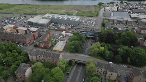 aerial fly over glasgow clyde tunnel crossing beneath from the part of west end entrance, glasgow, scotland, uk