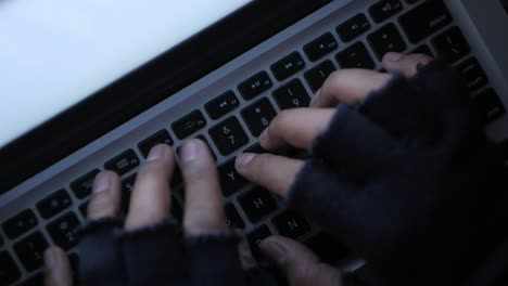 person typing on a laptop keyboard