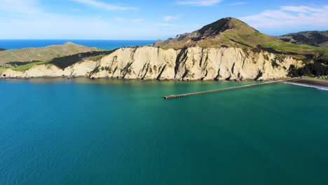 aerial panorama of long wharf, white cliffs and new zealand seaside, tolaga bay