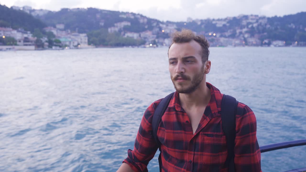 Sad man thoughtful on the ferry.