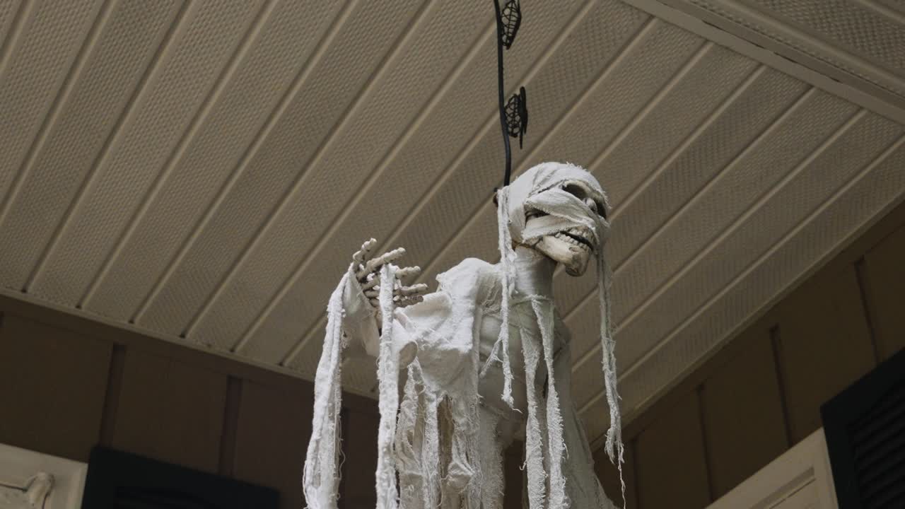 Pulling back to reveal a spooky ghoul decoration