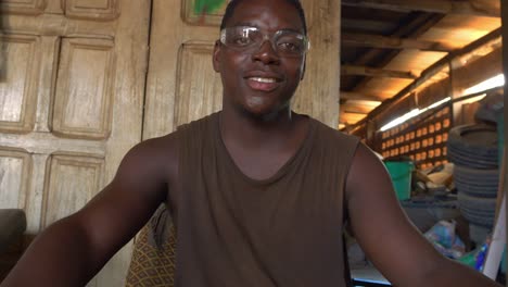 Close-Shot-Young-African-Iron-Saw-Repair-Worker-wearing-Protective-Glasses