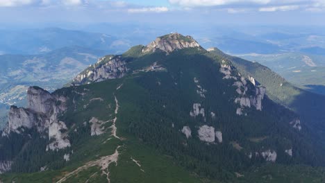aerial drone footage of ceahlău mountain and toaca peak, romania