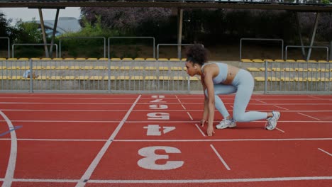 woman preparing for a race on a track