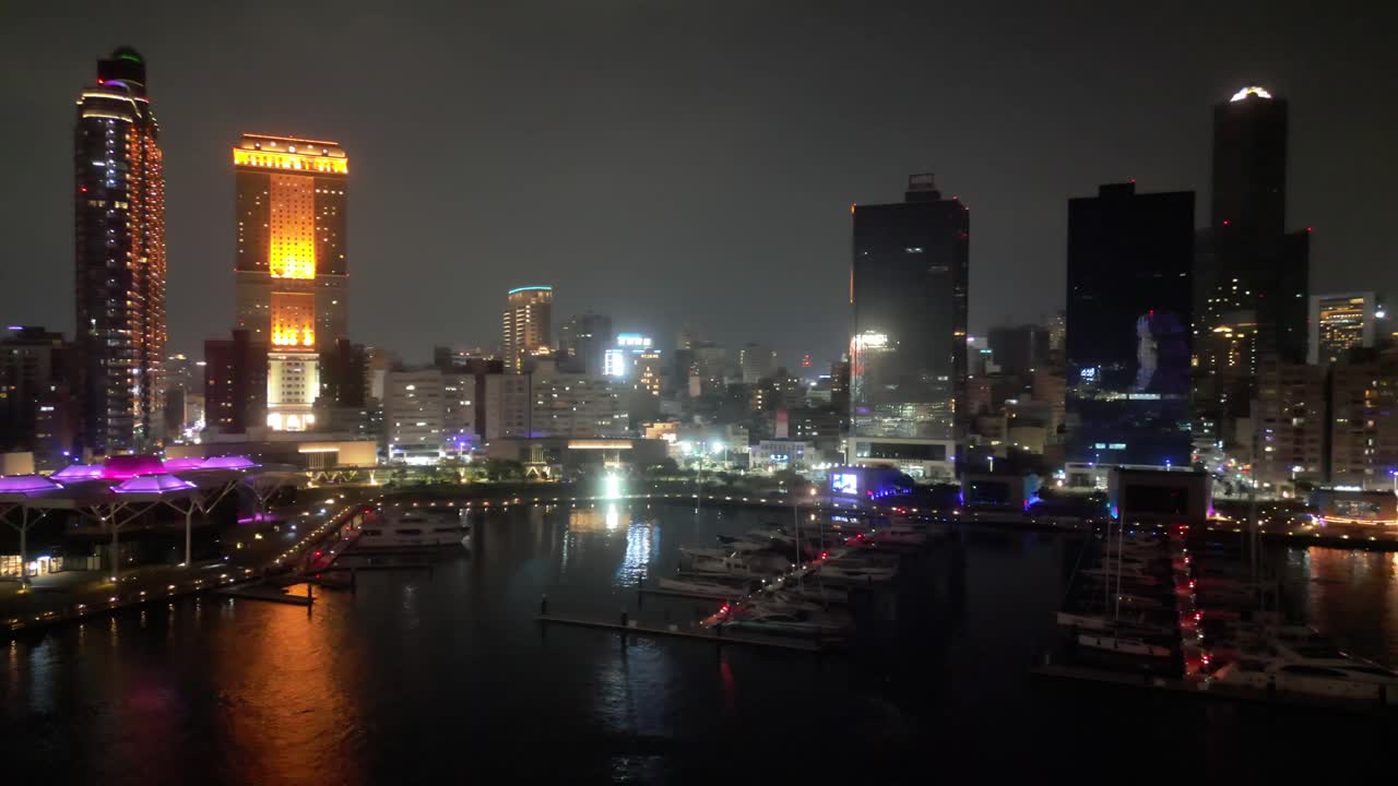 Night View of a City Skyline with Marina