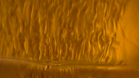 liquid golden waves going from top to bottom