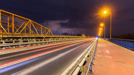 Road-time-lapse-with-cars-passing,-night-time