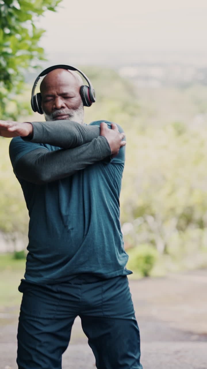 Man stretching outdoors with headphones