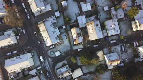 AERIAL:-Birds-View-Overhead-Drone-Shot-of-houses-roofs-covered-with-beautiful-white-snow,-Sunny,-Winter,-Germany