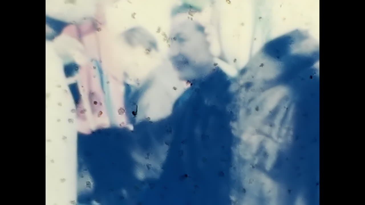 A Crowd of People Holding Flags and Balloons in Celebration of Soviet Union. CIRCA USSR 1970: A lively gathering of Soviet people holding flags and balloons, showcasing their enthusiasm for the Soviet Union and its ideals of socialism and communism.