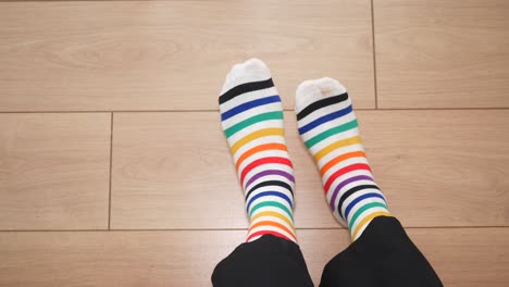 person wearing colorful striped socks