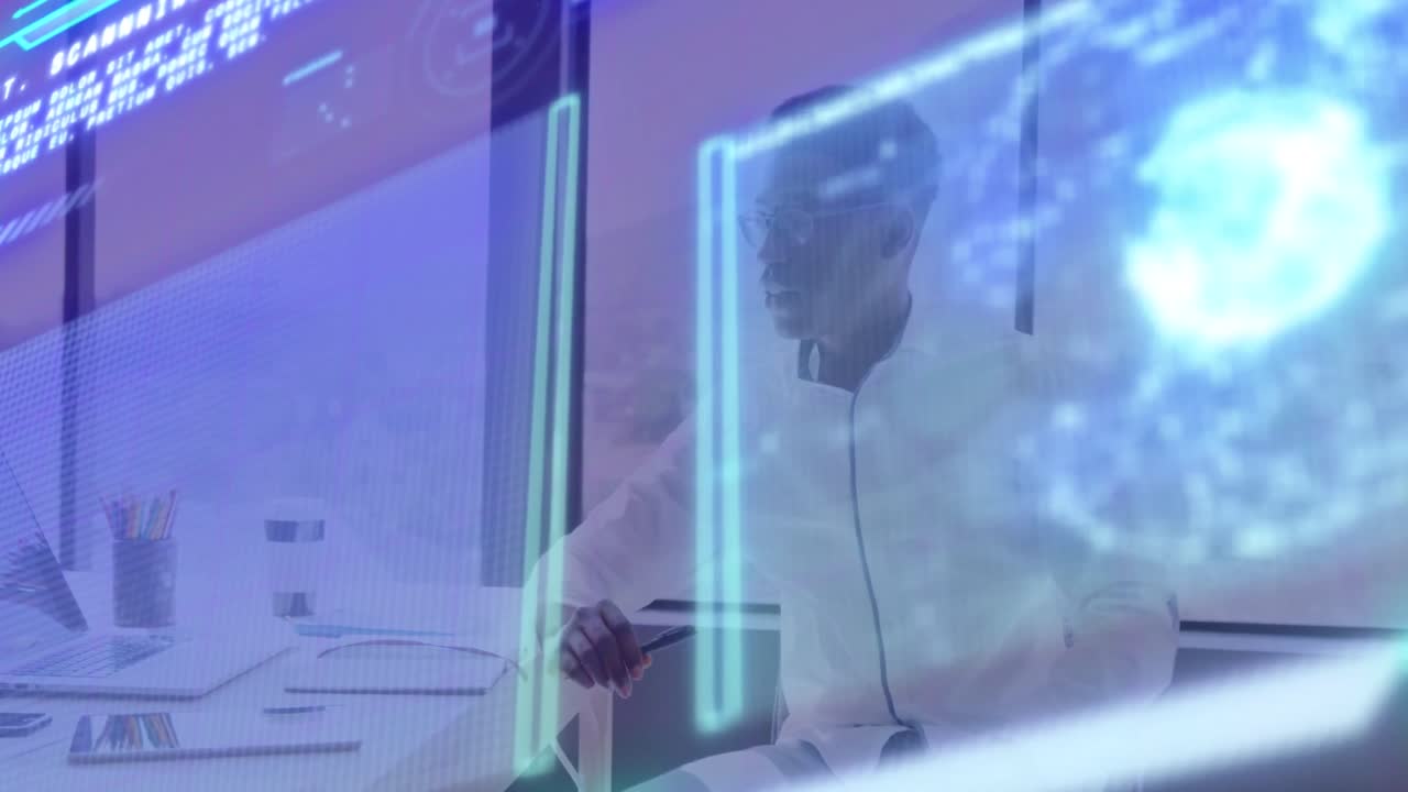 Animation of graphs, globe over thoughtful african american man working on laptop at office