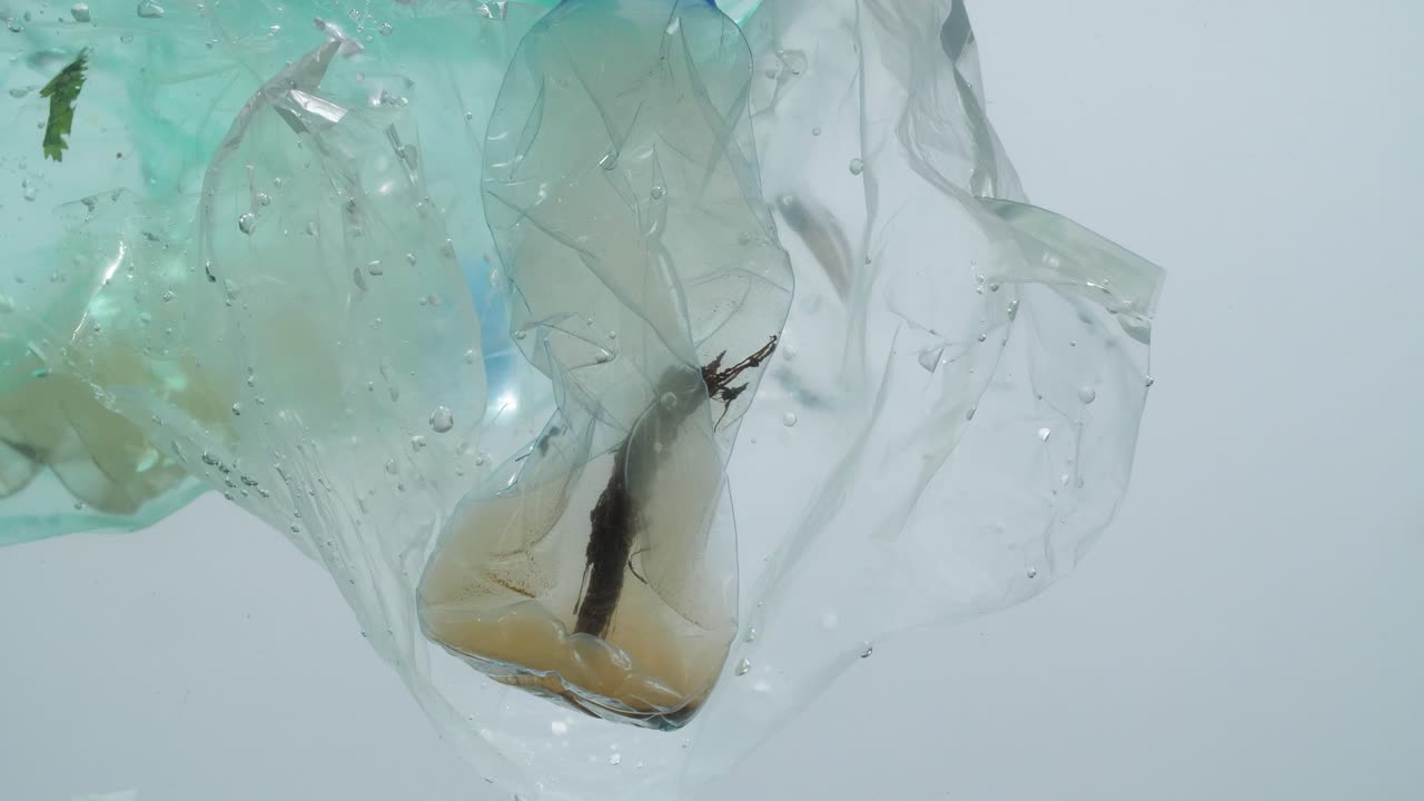Underwater Footage Of Plastic Pollution Problem Concept In Ocean
