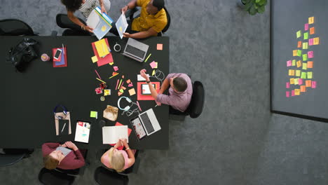 Group-of-diverse-colleagues-using-technology