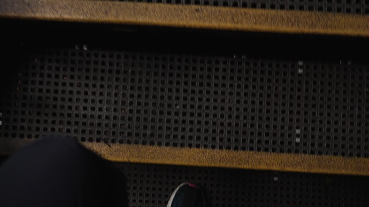 Climbing stairs of metro station, bridge staircase metal industrial POV