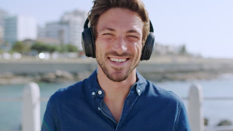 Headphones,-smile-and-face-of-man-at-beach