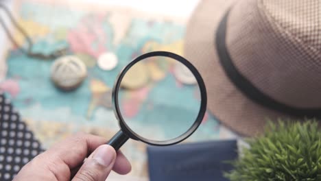 travel planning with magnifying glass