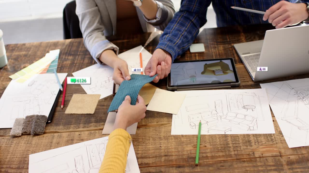 Designer grabbing teal swatch, passing as team comparing sketches, tablet overlays, checking color