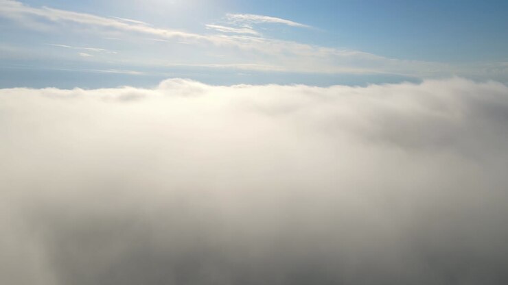 Flying in the clouds flying in the clouds. The clouds are moving on camera. Flying through the cloud