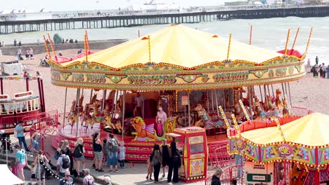 colorful carousel spinning on brighton beach