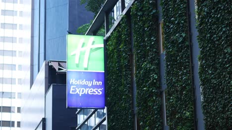 holiday inn express hotel building with ivy wall