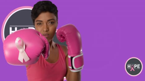 Animation-of-breast-cancer-awareness-text-over-biracial-female-boxer