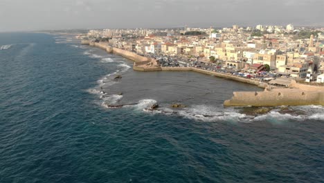 aerial footage over the old city of acre and the mediterranean sea