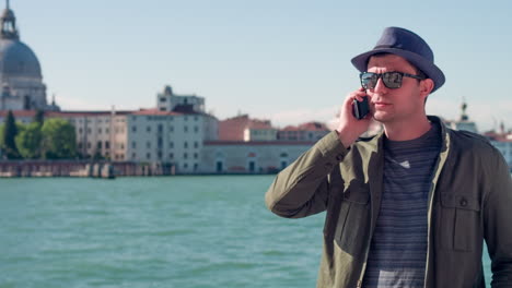 man talking on phone in venice