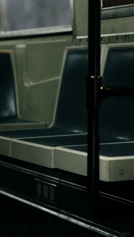 empty subway car with dim lighting during late night hours