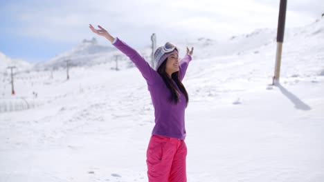 Happy-young-woman-celebrating-her-winter-vacation