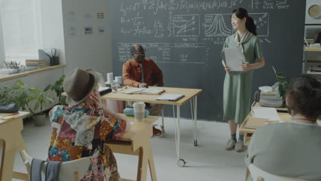 adult students attending a science lecture in a classroom
